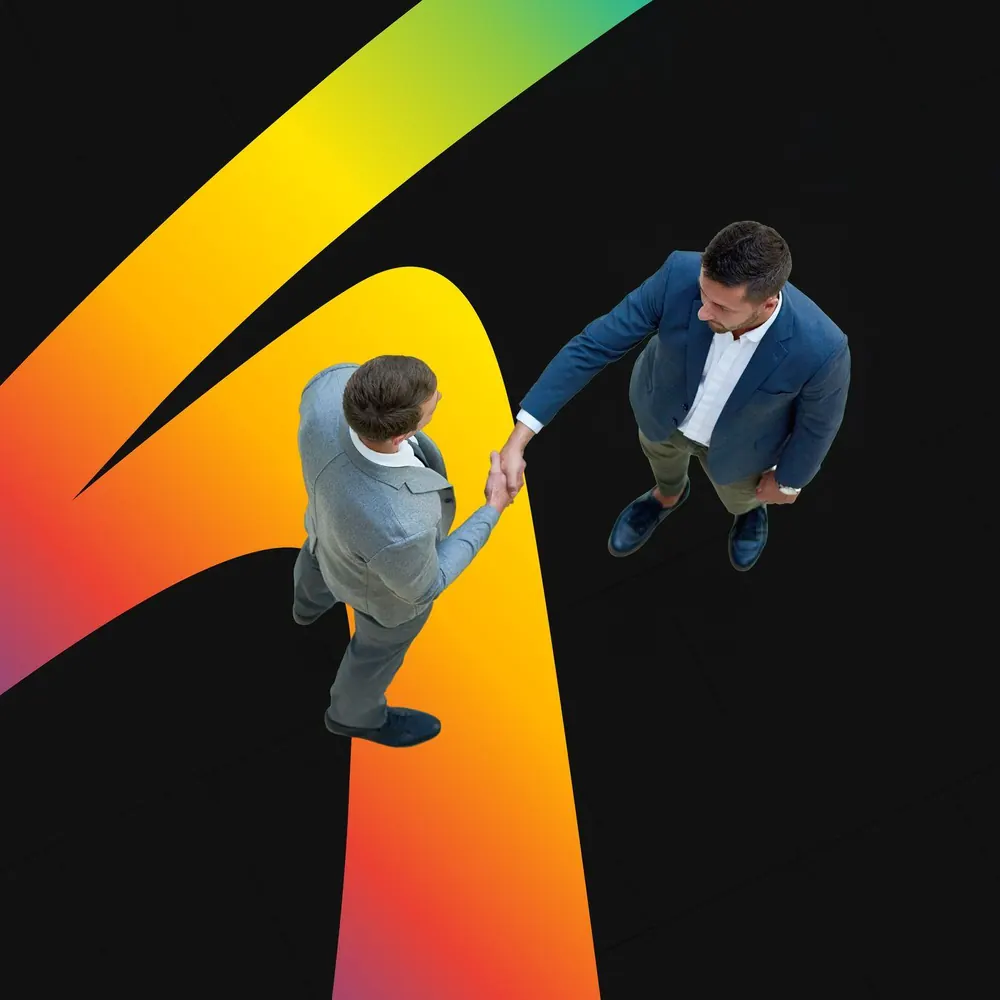 Two business partners shaking hands, representing The Shades brand partnership